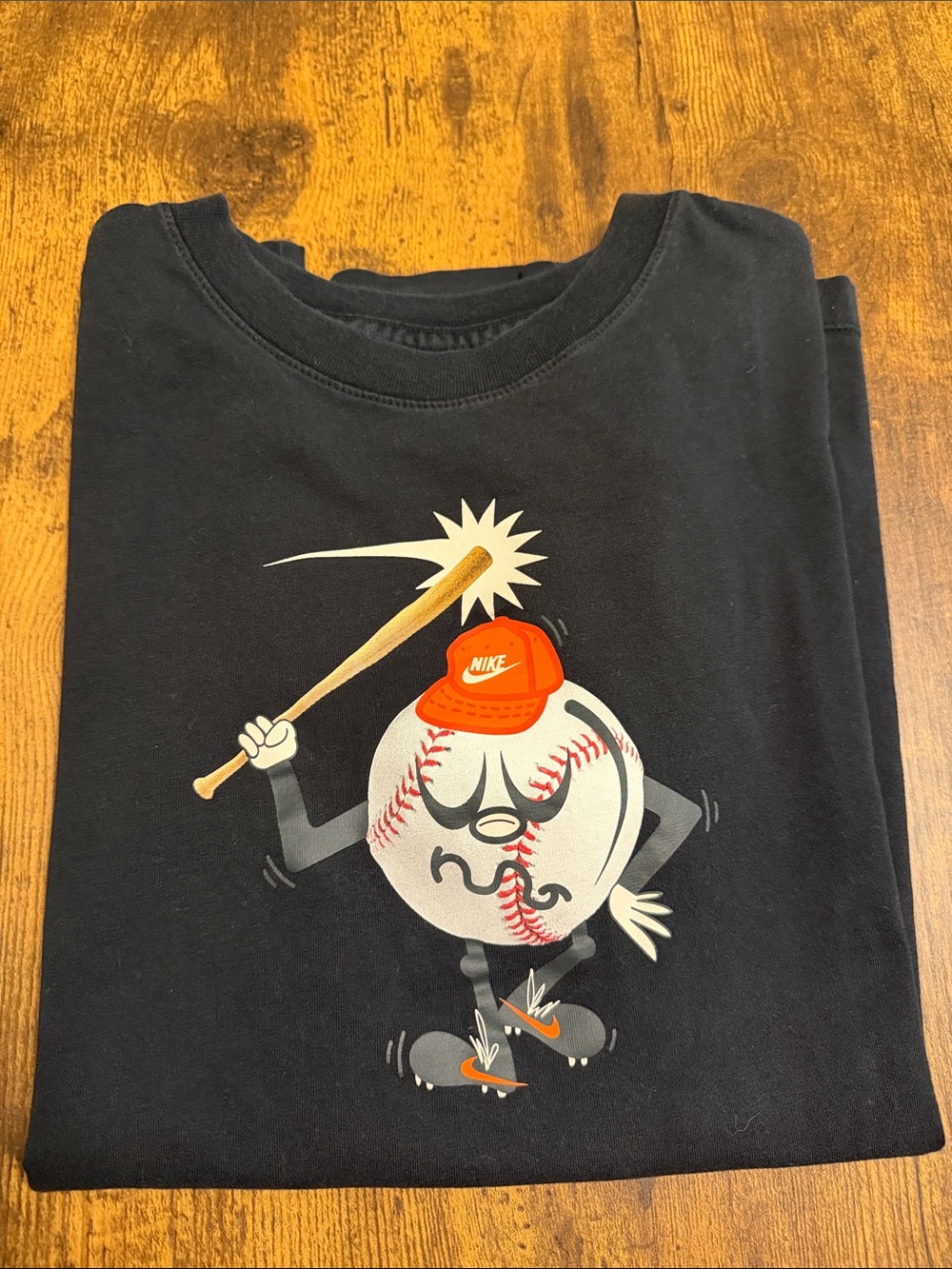 Nike Black Kids Graphic Baseball Tee with Orange Accent